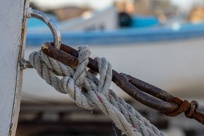 Close-up of rope tied on rusty metal