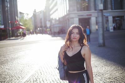 Portrait of beautiful woman on street in city