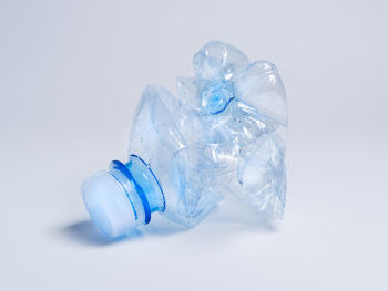 Close-up of glass bottle against white background