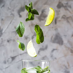 Close-up of leaves falling in lemonade