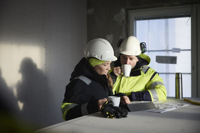 Engineers talking at building site