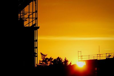 Silhouette of built structure at sunset