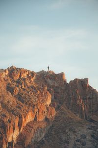 Rock formations on landscape against sky