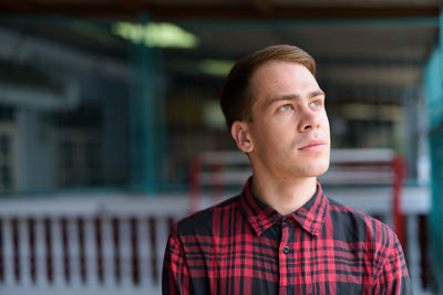 Portrait of young man looking away