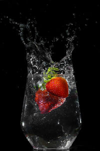 Close-up of strawberry over white background