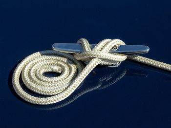 Close-up of rope against black background