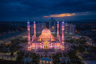Mosque named after the prophet muhammad in the city of shali. illuminated buildings in city at night