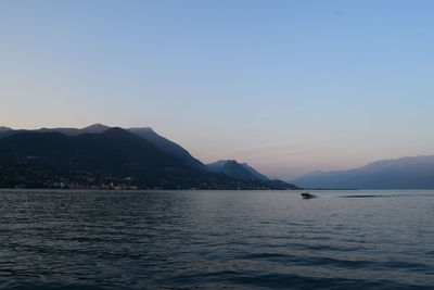 Scenic view of sea against clear sky during sunset