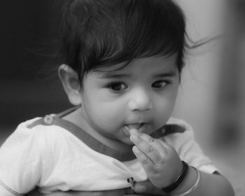 Close-up portrait of cute baby at home