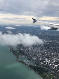 Aerial view of cityscape against sky