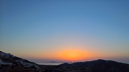Scenic view of silhouette mountains against sky during sunset