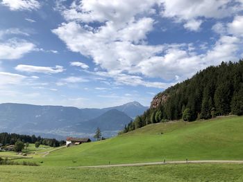 Scenic view of landscape and mountains against sky