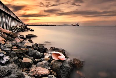 Scenic view of sea against sky during sunset