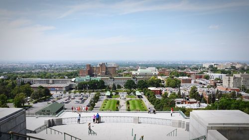 High angle view of buildings in city against sky