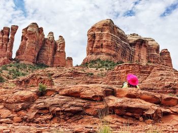 Low angle view of rocks on rock against sky