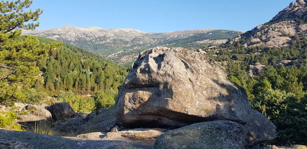 Panoramic shot of rocks against clear sky