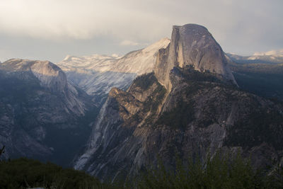 View of mountain range against cloudy sky