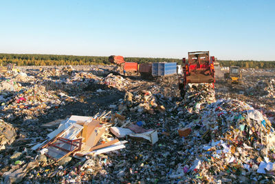High angle view of garbage on field against buildings