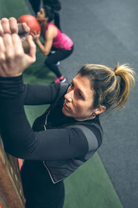 High angle view of woman exercising in gym