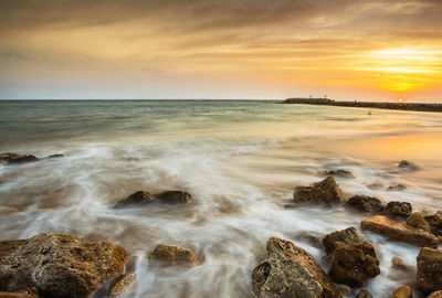 Scenic view of sea against sky during sunset