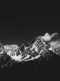 Scenic view of snowcapped mountains against sky during winter