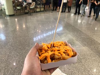 Low section of person holding food