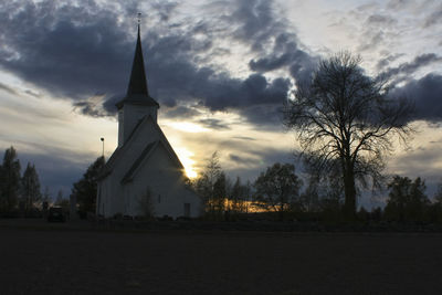 Low angle view of church against cloudy sky