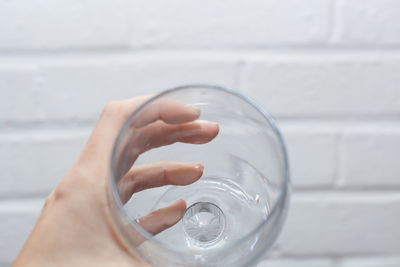 Close-up of hand holding water