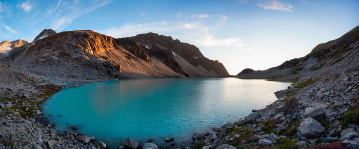 Panoramic view of lake and mountains against sky
