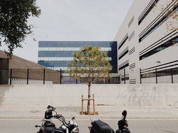 Bicycle on street against buildings in city