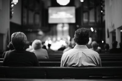 Rear view of people sitting on benches in la crescenta presbyterian church