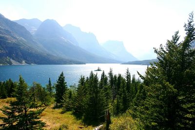 Scenic view of lake and mountains against clear sky