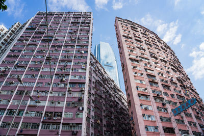 Low angle view of skyscraper against sky