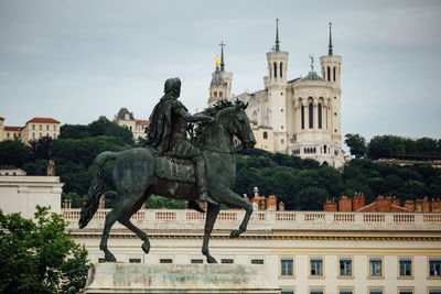 Equestrian statue of louis xiv on place bellecour in the old town of lyon.