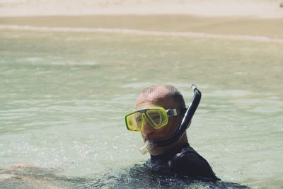 Portrait of man swimming in sea