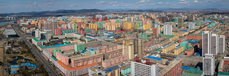 High angle view of city buildings against sky