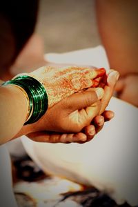 Cropped hands of bride and groom during wedding ceremony