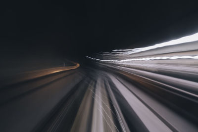 Close-up of light trails on car at night