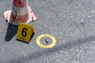 High angle view of road sign on street