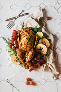 Duck poached for thanksgiving with grapes, quince, rosemary and thyme