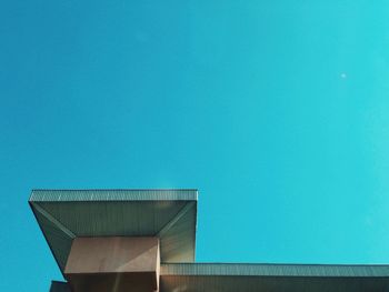 Low angle view of built structure against clear blue sky