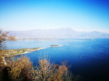 High angle view of sea against blue sky