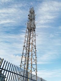 Low angle view of communications tower against sky