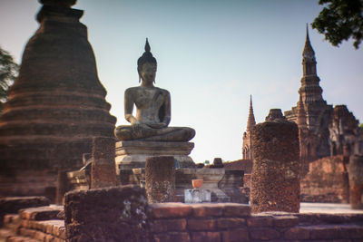 Ancient buddha statue it was built of bricks and mortar at the sukhothai historical park, thailand