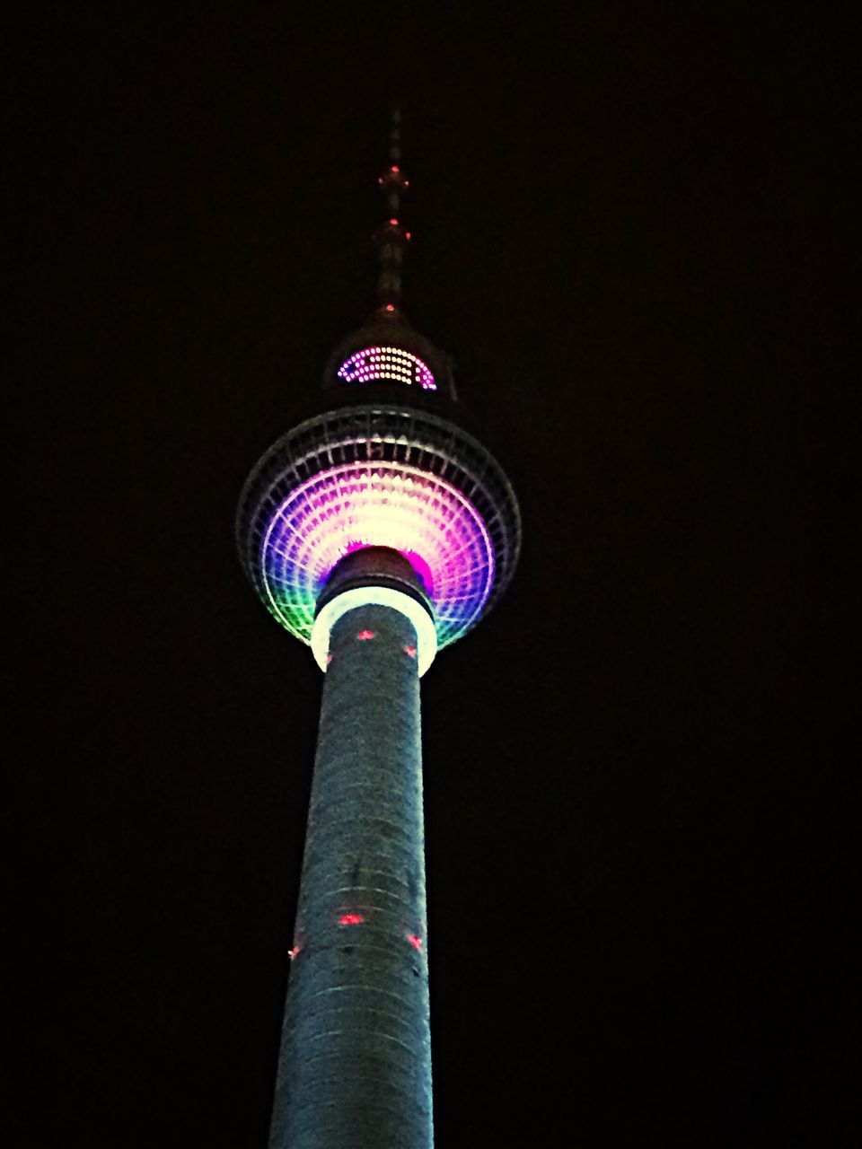 tower, tall - high, low angle view, communications tower, architecture, international landmark, built structure, capital cities, famous place, communication, tourism, travel destinations, illuminated, building exterior, travel, fernsehturm, spire, night, culture, television tower