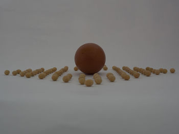 High angle view of bread on table against white background