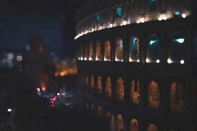 Illuminated building in city at night