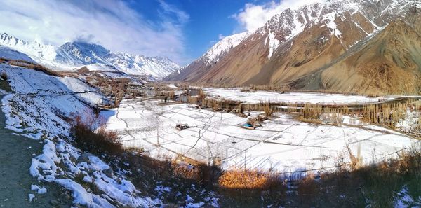 Scenic view of snowcapped mountains against sky