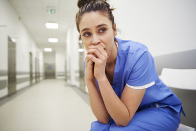 Sad doctor sitting in hospital