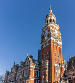 Low angle view of building against clear blue sky